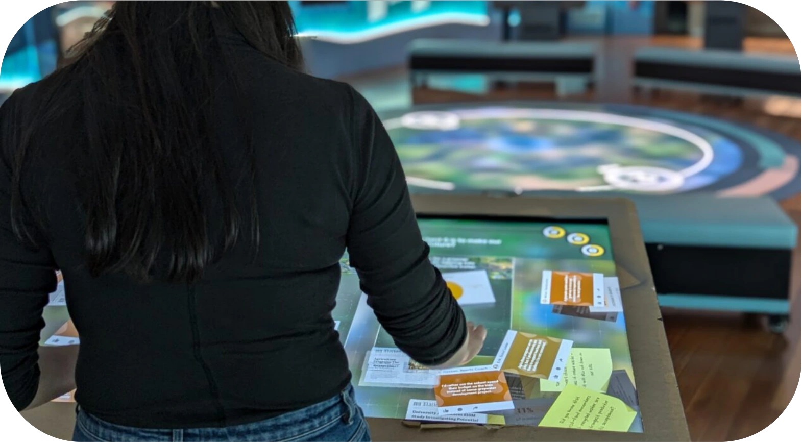 Visitor using a Future Water Story interactive table